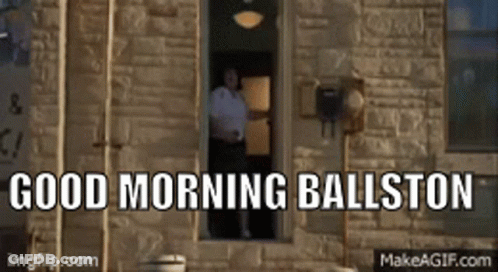 A Man Standing In A Window With The Words Good Morning Ballston Written Above Him GIF