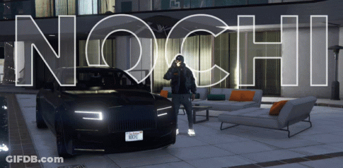 A Man Standing In Front Of A Black Car With The Word Nochi Written On It GIF