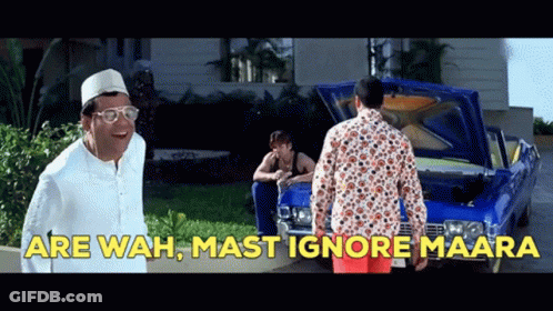 A Man Standing In Front Of A Blue Car With The Words " Are Wah Mast Ignore Maara " On The Bottom GIF