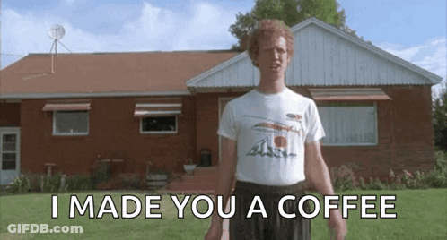 A Man Standing In Front Of A Brick House With The Words I Made You A Coffee GIF