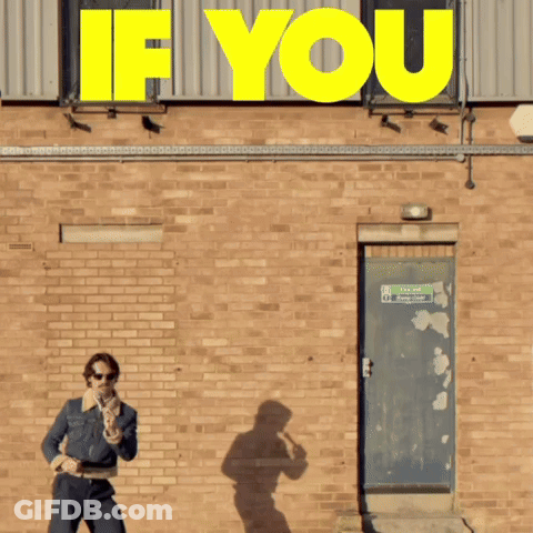 A Man Standing In Front Of A Brick Wall With A Sign That Says " If You " GIF