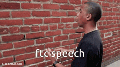 A Man Standing In Front Of A Brick Wall With The Words Ftc Speech Written On The Bottom GIF