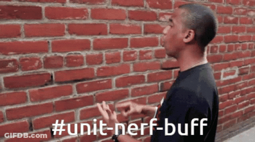 A Man Standing In Front Of A Brick Wall With #Unit-Nerf-Buff Written On The Bottom GIF