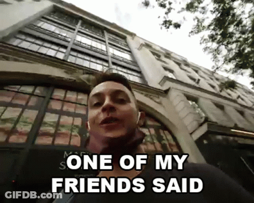 A Man Standing In Front Of A Building With The Words One Of My Friends Said GIF