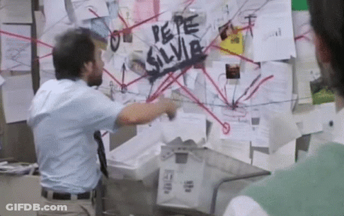 A Man Standing In Front Of A Bulletin Board That Says " Pepe Silvia " GIF