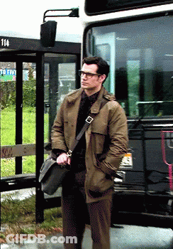 Man Standing In Front Of Bus Number 114 GIF