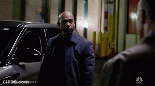 A Man Standing In Front Of A Car With #Chicagopd On The Bottom GIF