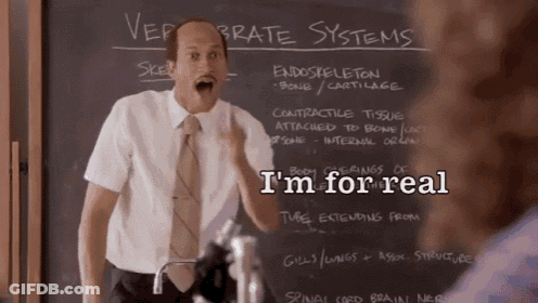 A Man Standing In Front Of A Chalkboard With The Words I 'M For Real On It GIF