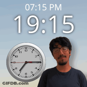 A Man Standing In Front Of A Clock That Says 19:15 Pm GIF