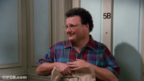 A Man Standing In Front Of A Door That Says 5B On It GIF