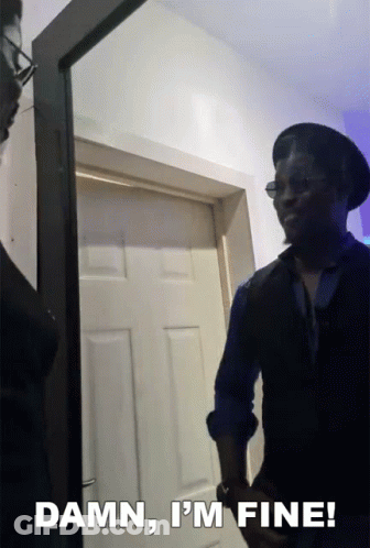 A Man Standing In Front Of A Door With The Words " Damn I 'M Fine " Above Him GIF