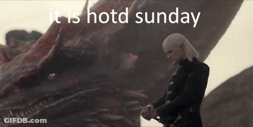 A Man Standing In Front Of A Dragon With The Words " It Is Hotd Sunday " Below Him GIF