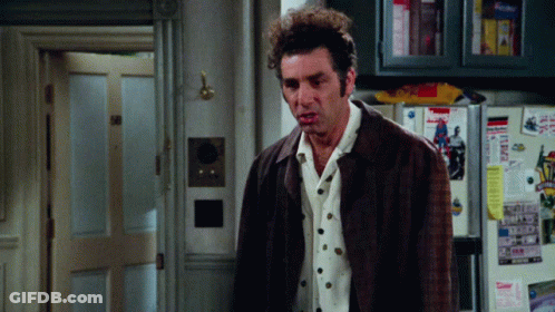 A Man Standing In Front Of A Fridge That Has A Sticker On It That Says ' Today ' On It GIF