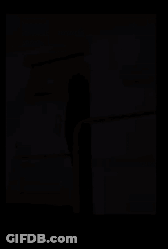 A Man Standing In Front Of A Glass Door With A Sign That Says Hotel Lounge Pool GIF