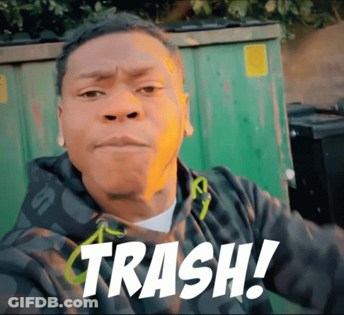 A Man Standing In Front Of A Green Trash Can With The Word Trash Written On His Face GIF