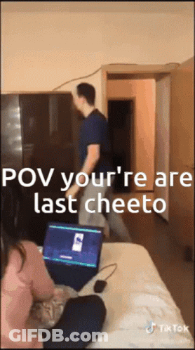 A Man Standing In Front Of A Laptop That Says Pov Your 'Re Are Last Cheeto On It GIF