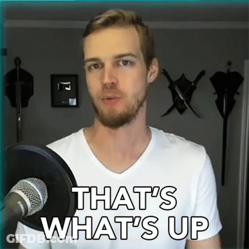 A Man Standing In Front Of A Microphone With The Words That 'S What 'S Up GIF