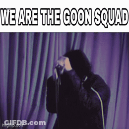 A Man Standing In Front Of A Purple Curtain With The Words " We Are The Goon Squad " GIF
