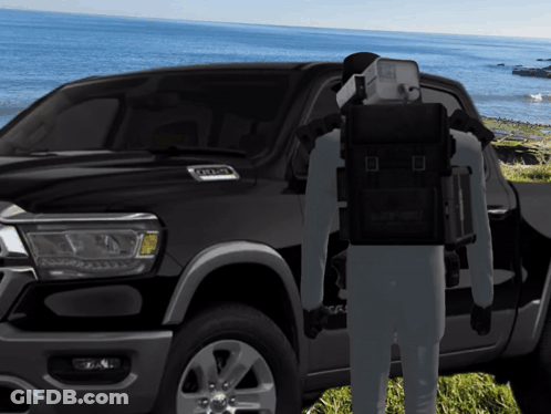 A Man Standing In Front Of A Ram Truck GIF