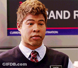 A Man Standing In Front Of A Sign That Says " And " GIF