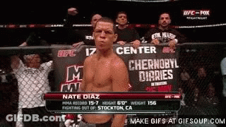 A Man Standing In Front Of A Sign That Says Center GIF