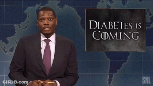 A Man Standing In Front Of A Sign That Says Diabetes Is Coming GIF