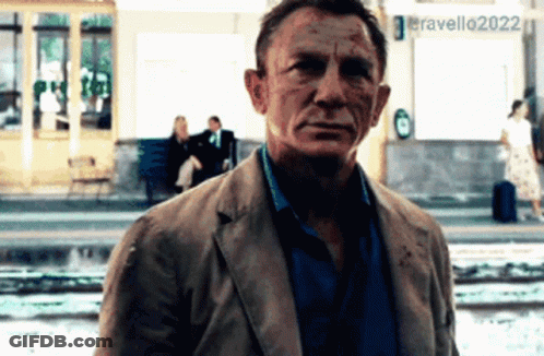 A Man Standing In Front Of A Sign That Says Eravello 2022 GIF