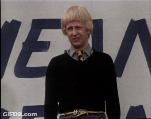 A Man Standing In Front Of A Sign That Says " Get It Right " GIF