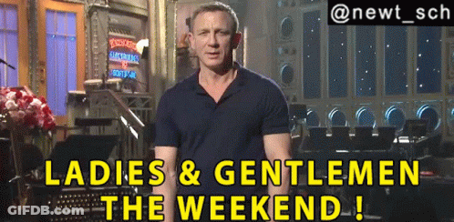 A Man Standing In Front Of A Sign That Says Ladies And Gentlemen The Weekend GIF