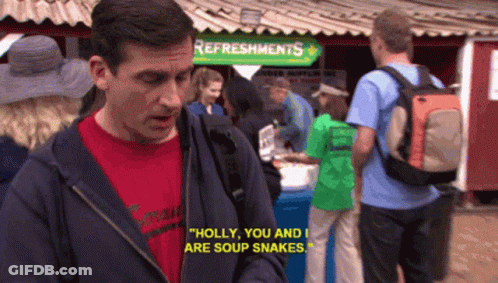 A Man Standing In Front Of A Sign That Says " Refreshments " GIF