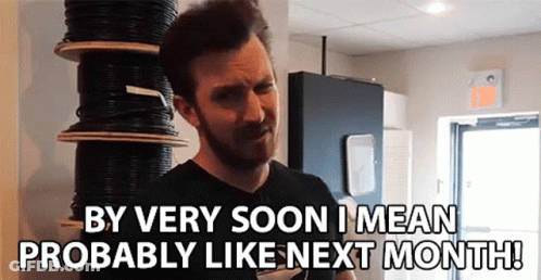 A Man Standing In Front Of A Stack Of Wires Says By Very Soon I Mean Probably Like Next Month ! GIF