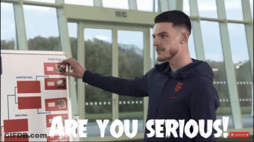 A Man Standing In Front Of A White Board That Says Are You Serious GIF