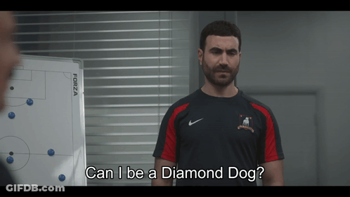 A Man Standing In Front Of A White Board With The Words Can I Be A Diamond Dog GIF