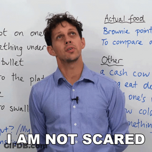 A Man Standing In Front Of A White Board With The Words I Am Not Scared GIF