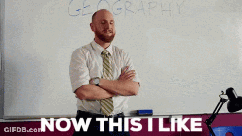 Man Standing In Front Of Geography Whiteboard GIF