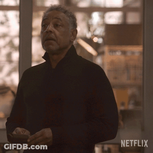 A Man Standing In Front Of A Window With A Netflix Logo On The Bottom GIF