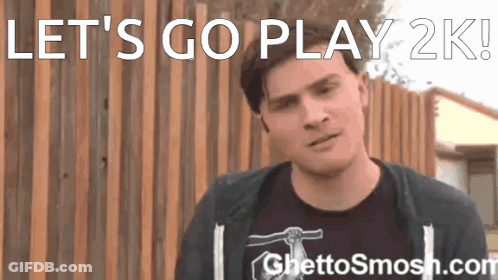 A Man Standing In Front Of A Wooden Fence With The Words Let 'S Go Play 2K Written Above Him GIF