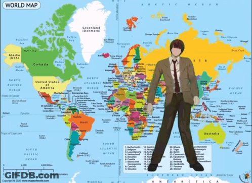 A Man Standing In Front Of A World Map GIF