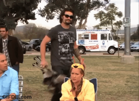 A Man Standing In Front Of An Ice Cream Truck That Says ' Coral ' On The Side GIF