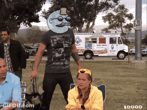 A Man Standing In Front Of An Ice Cream Truck That Says ' Ice Cream ' On It GIF