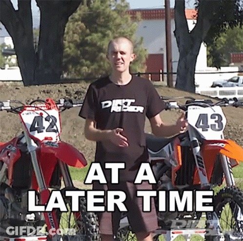 A Man Standing In Front Of Two Dirt Bikes With The Words At A Later Time GIF