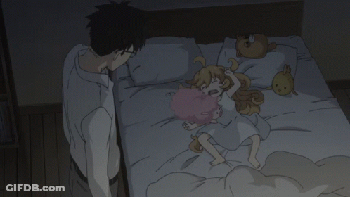 A Man Standing Next To A Bed With A Little Girl Laying On It GIF