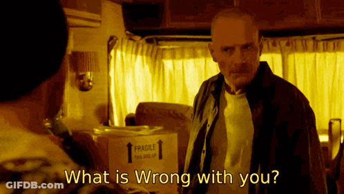 A Man Standing Next To A Box That Says " Fragile " On It GIF