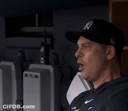 A Man Standing Next To A Bullpen Box GIF