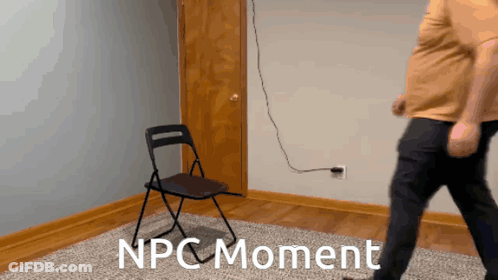 A Man Standing Next To A Folding Chair With The Words Npc Moment On The Floor GIF