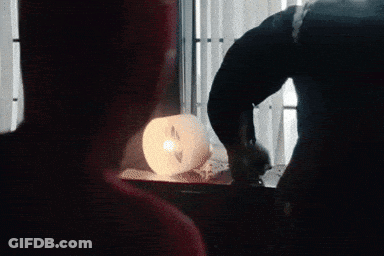 A Man Standing Next To A Giant Monster In A Room GIF