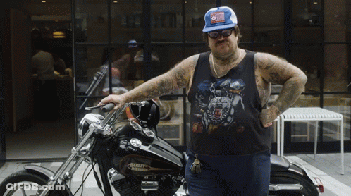 Man Standing Next To Harley Davidson Motorcycle GIF
