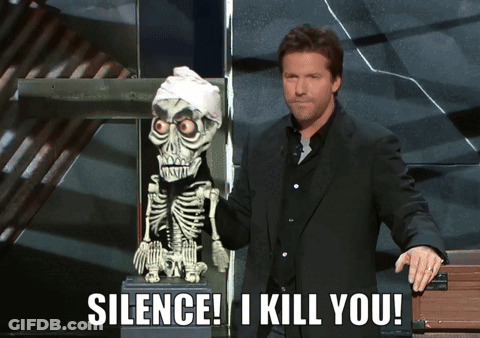 A Man Standing Next To A Skeleton With The Words Silence I Kill You On The Bottom GIF