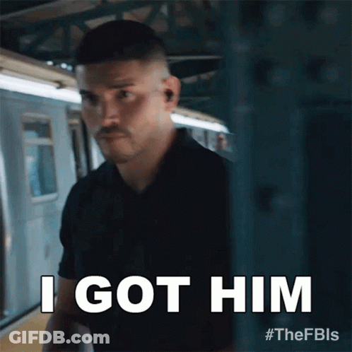 A Man Standing Next To A Train With The Words I Got Him GIF