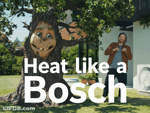 A Man Standing Next To A Tree That Says Heat Like A Bosch On It GIF